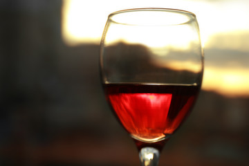 Glass of red wine on blurred background