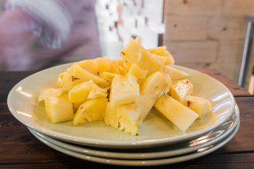 pineapple slice on white plate