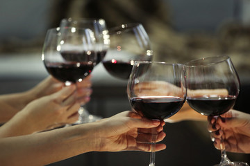 Glasses of red wine on a cheerful holiday