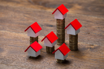 House Models On Stacked Coins