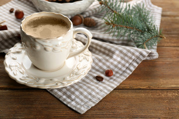 Cup of coffee and Christmas tree branch on napkin