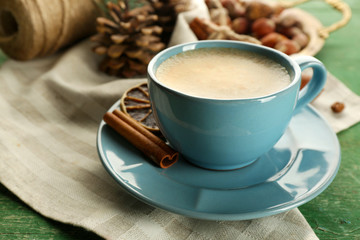 Cup of coffee on napkin near meta tray