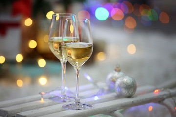 Two glasses of wine on Christmas decoration background