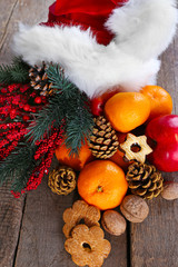Santa hat filled with Christmas gifts, close-up