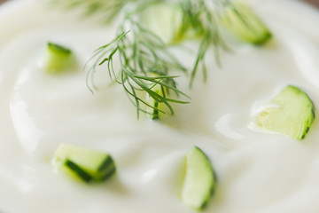 Cucumber yogurt in glass bowl