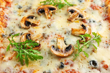 Freshly homemade pizza with mushrooms and rosemary closeup
