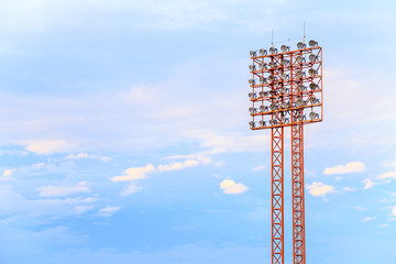 Obraz premium Lighting tower of stadium on sky and cloud background.