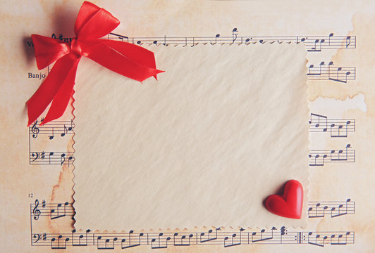 Blank present Valentine card on music sheet background