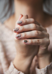 Female hand with Christmas manicure. Fashion, nails.