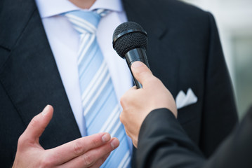 Journalist Taking Interview Of Businessman