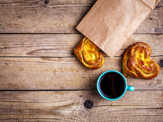 homemade pastries. bun heart in a paper bag. for Breakfast with coffee. Morning, drinks, food