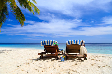 Two chairs on the tropical beach