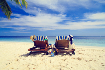 Two chairs on the tropical beach