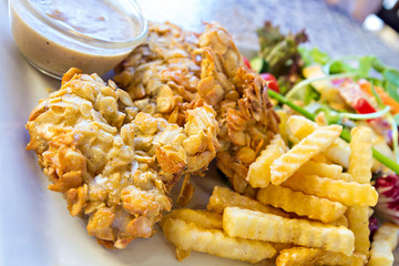 deep-fried fish steaks with almond flakes and friend fried