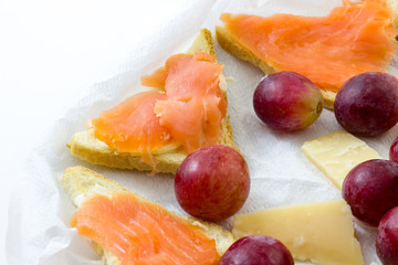 Salmon appetizer with grapes and cheese