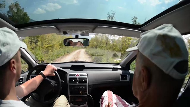 Father And Son Driving Together In A Car And Eat Ice Cream At Beautiful  Sunny Day