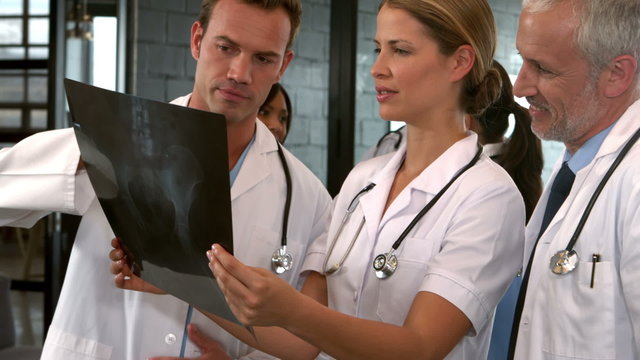 Medical team looking at x-ray during a meeting