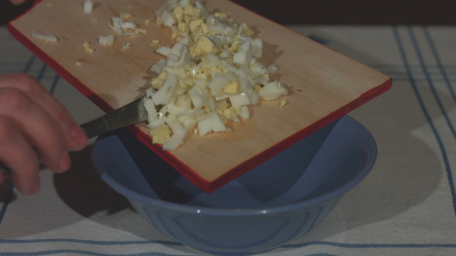 Preparation of salad from boiled eggs. Slow motion.