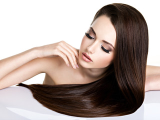 Portrait of beautiful young woman with long straight brown hair