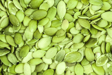 Background of peeled pumpkin sunflower seeds