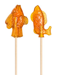 Set of sugar lollipop made in the shape of fishes, goldfishes on a wooden stick, isolated on the...