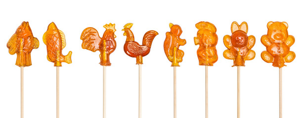 Set of sugar lollipops made in the shape of cockerels, fishes, goldfishes, squirrel, Piglet, bear,...