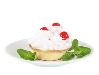 Cream cake with cherry on a white saucer, isolated on the white