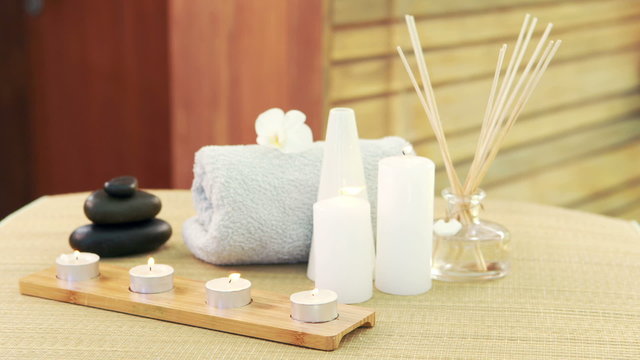 Oil, towel, candles and stones