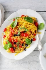 pasta with roasted tomato on plate