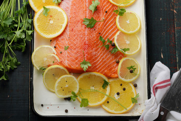 raw salmon fillet on baking dish