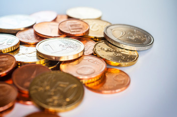 Few Euro coins isolated on white background