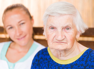 Elderly woman with caregiver