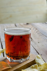 Cool Refreshing Dark Amber Beer against a Background