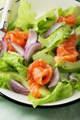 fresh salad with salmon and avocado slice