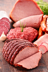 Assorted meat products including ham and sausages