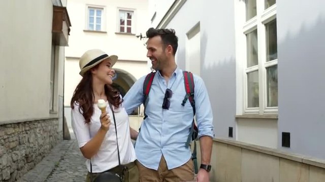 Couple of tourists in the street walking
