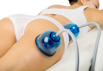Vacuum slimming massage treatment at clinic