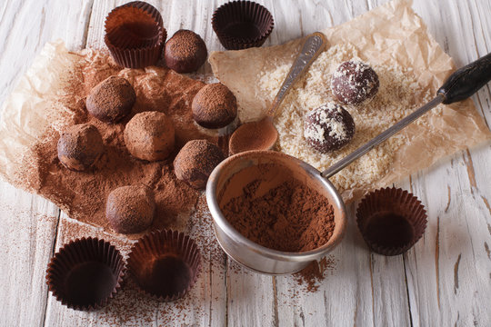sprinkling chocolate truffles cocoa powder and nuts. Horizontal
