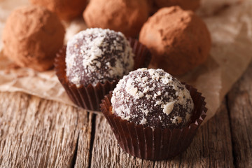 Chocolate truffles sprinkled with nuts macro. horizontal
