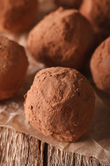 Homemade Chocolate truffles macro on a table in a rustic style. vertical
