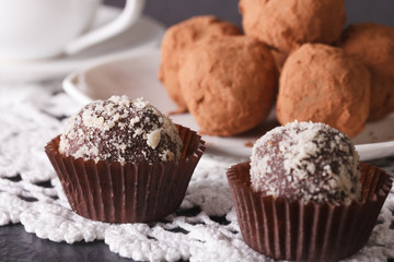 French chocolate truffle sweets closeup on a lace. Horizontal
