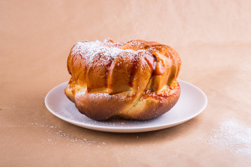 yeast cake with icing sugar on a plate