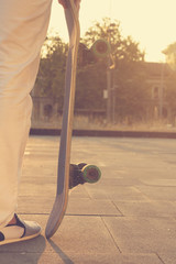 Hipster man with skateboarding.