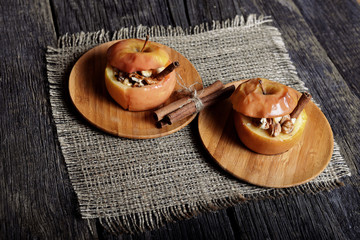 Baked apple with sugar and nuts