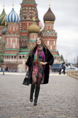 Young woman in a mink coat on the Red Square in Moscow