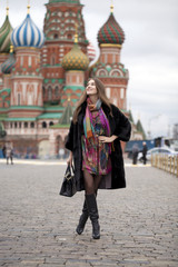Obraz premium Young woman in a mink coat on the Red Square in Moscow