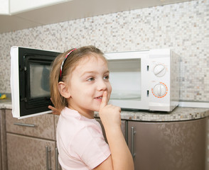 child without supervision   playing with microwave