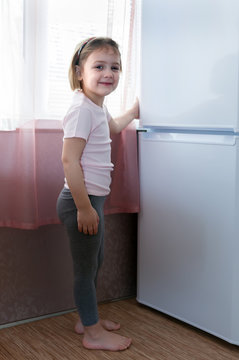 Child Playing With   Fridge