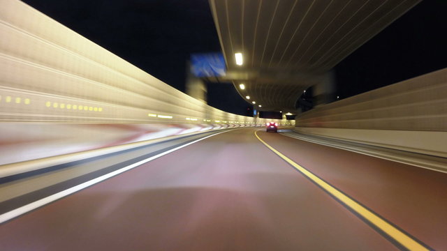 Nightlapse through the illuminated Tokyo's metropolitan streets.