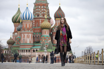 Fototapeta premium Young woman in a mink coat on the Red Square in Moscow
